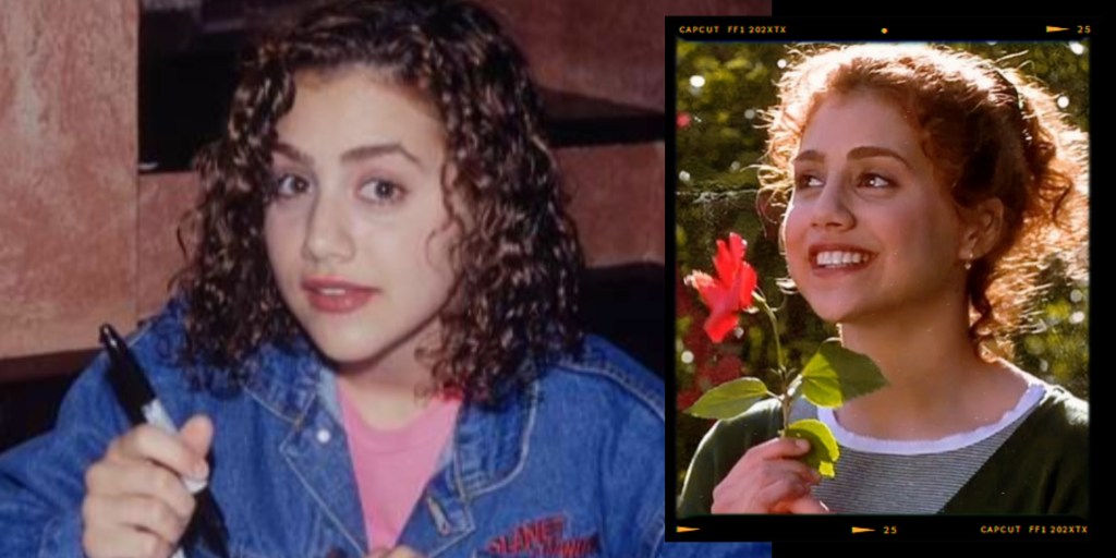 A young girl with curly hair and a denim jacket sitting at a table, holding a pen and looking towards the camera.
