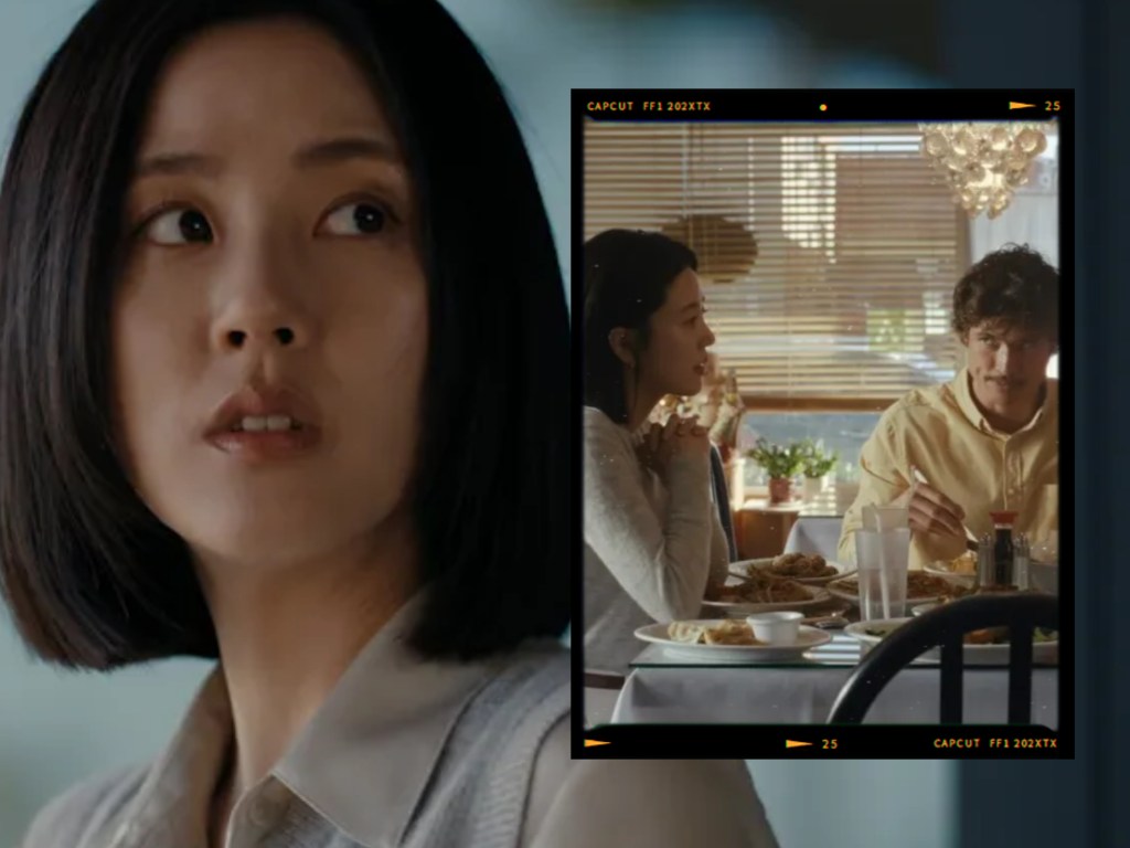 A close-up of a woman's face showing concern or contemplation, with a blurred background of a restaurant scene featuring two people eating at a table.